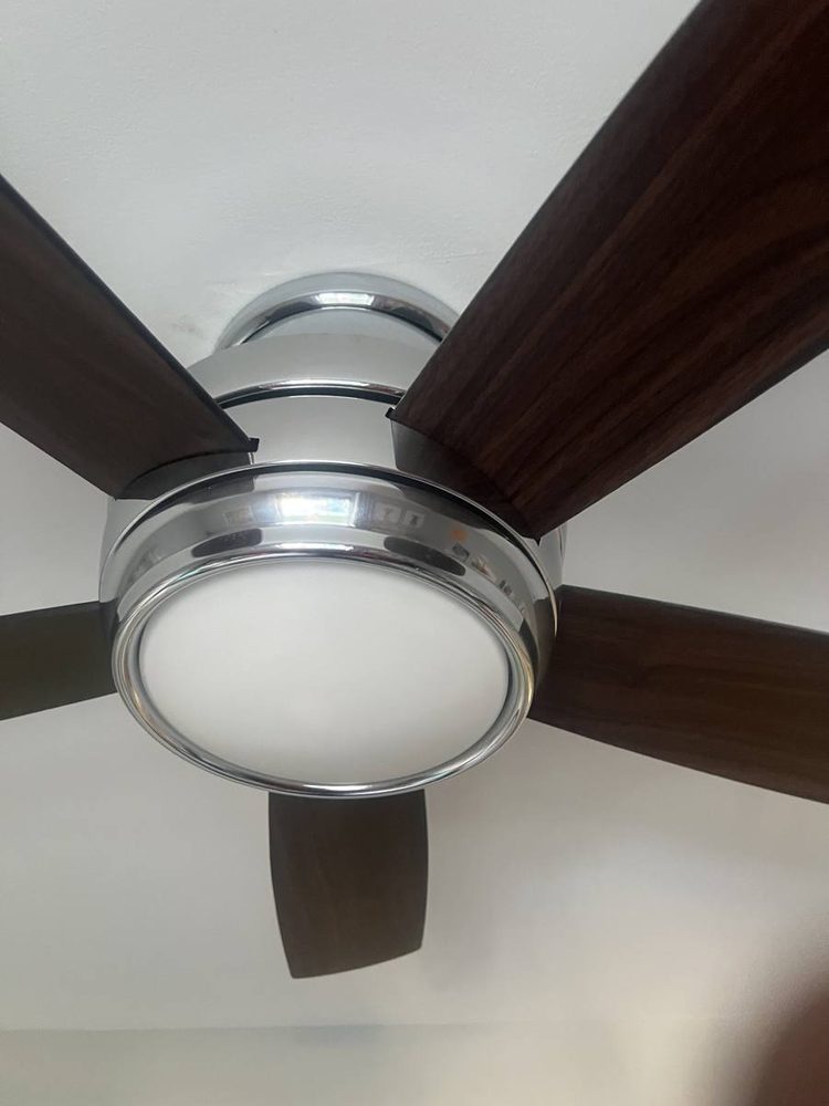 Ceiling fan mounted and wired in a residential room