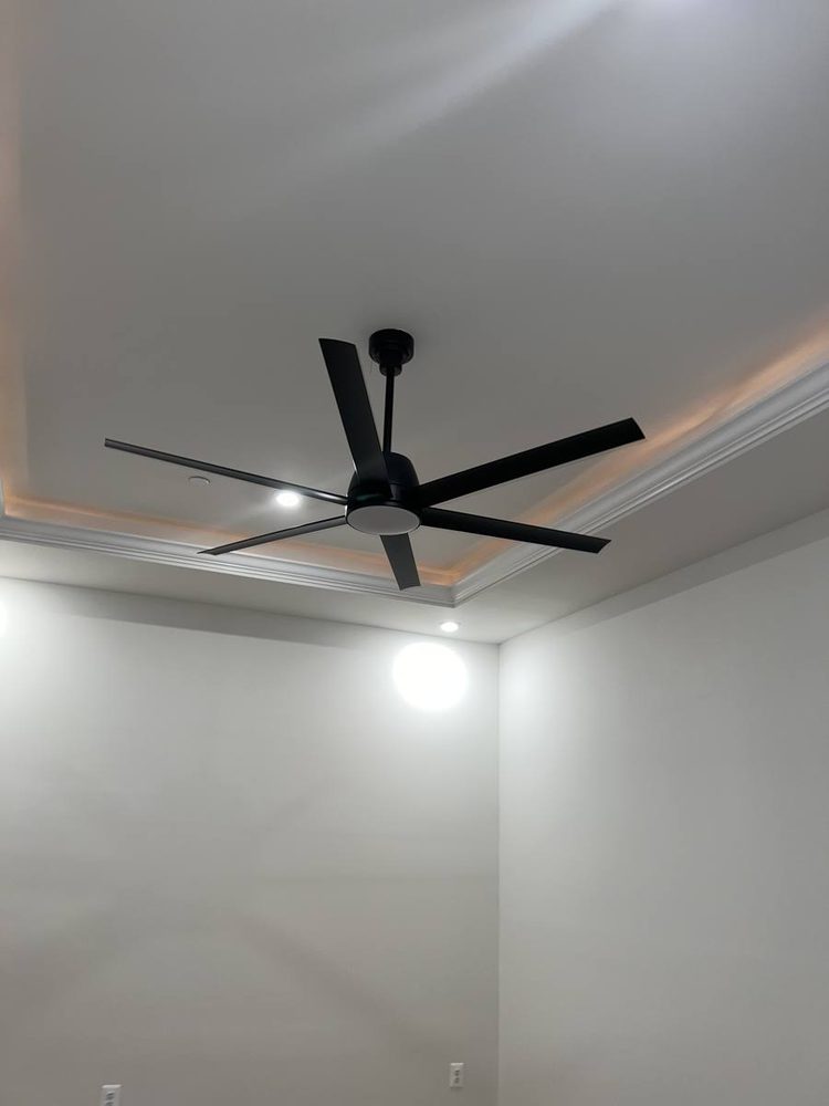 Ceiling fan mounted and wired in a residential room