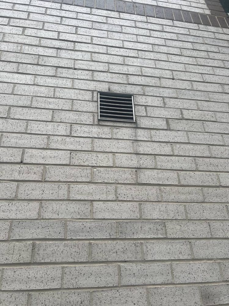 Exterior dryer vent hood and wall penetration