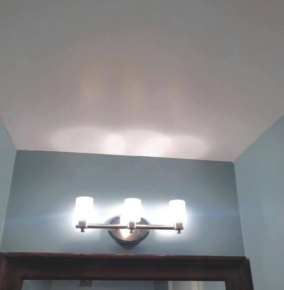Wall and ceiling drywall finished and painted after patching