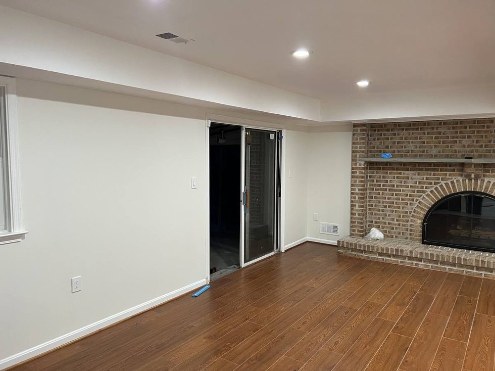 Hardwood flooring repaired and refinished in a residential room