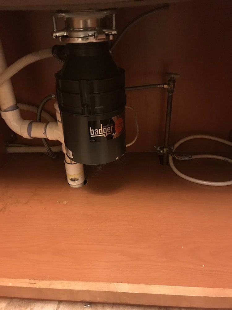 Garbage disposal unit installed under a kitchen sink