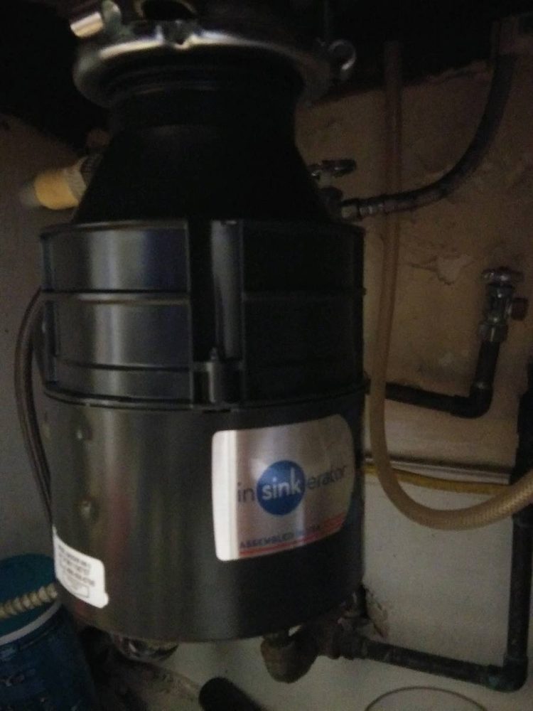 Garbage disposal unit installed under a kitchen sink