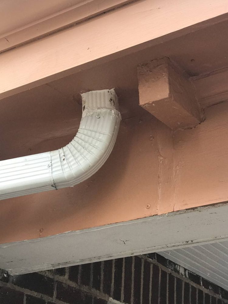 Gutter and downspout repaired on a residential roofline