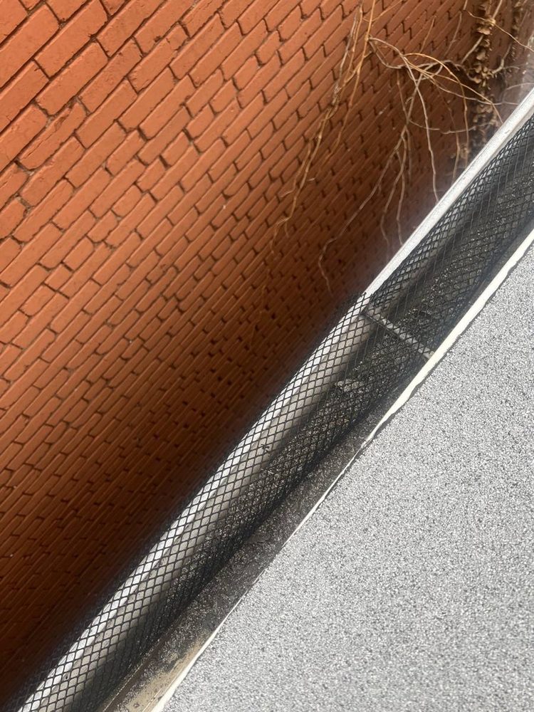 Gutter and downspout repaired on a residential roofline