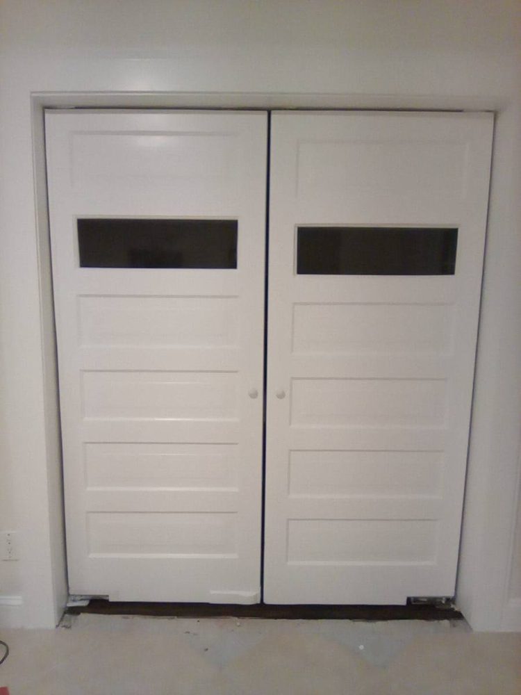 Interior door hung, trimmed and finished in a doorway