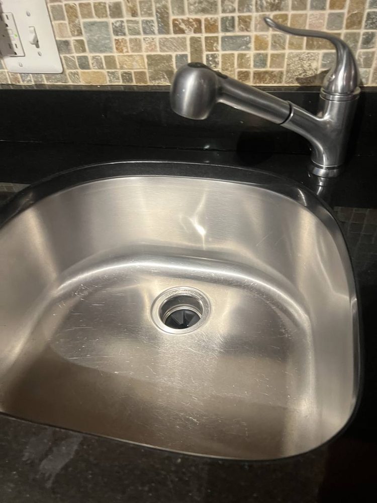 Kitchen sink and faucet installed in a countertop