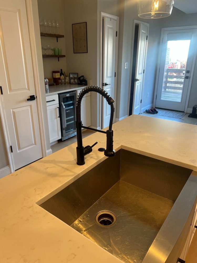 Kitchen sink and faucet installed in a countertop