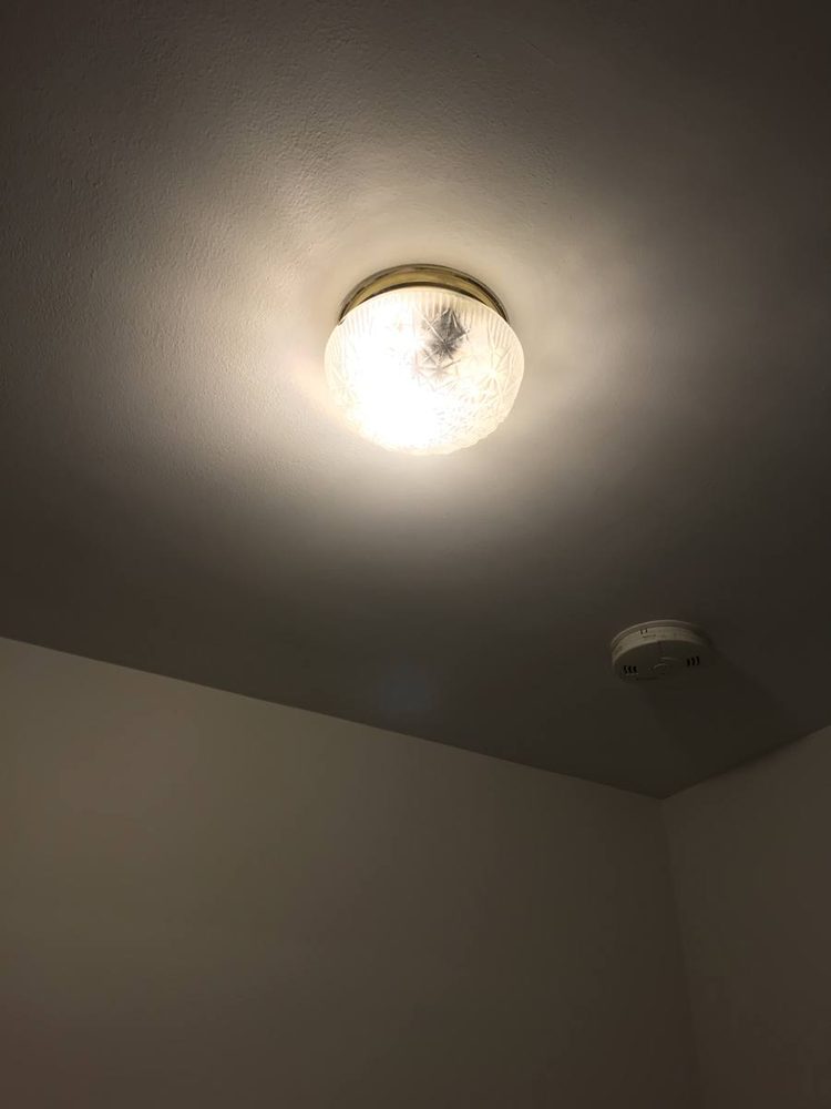 Light fixture mounted and wired to a ceiling