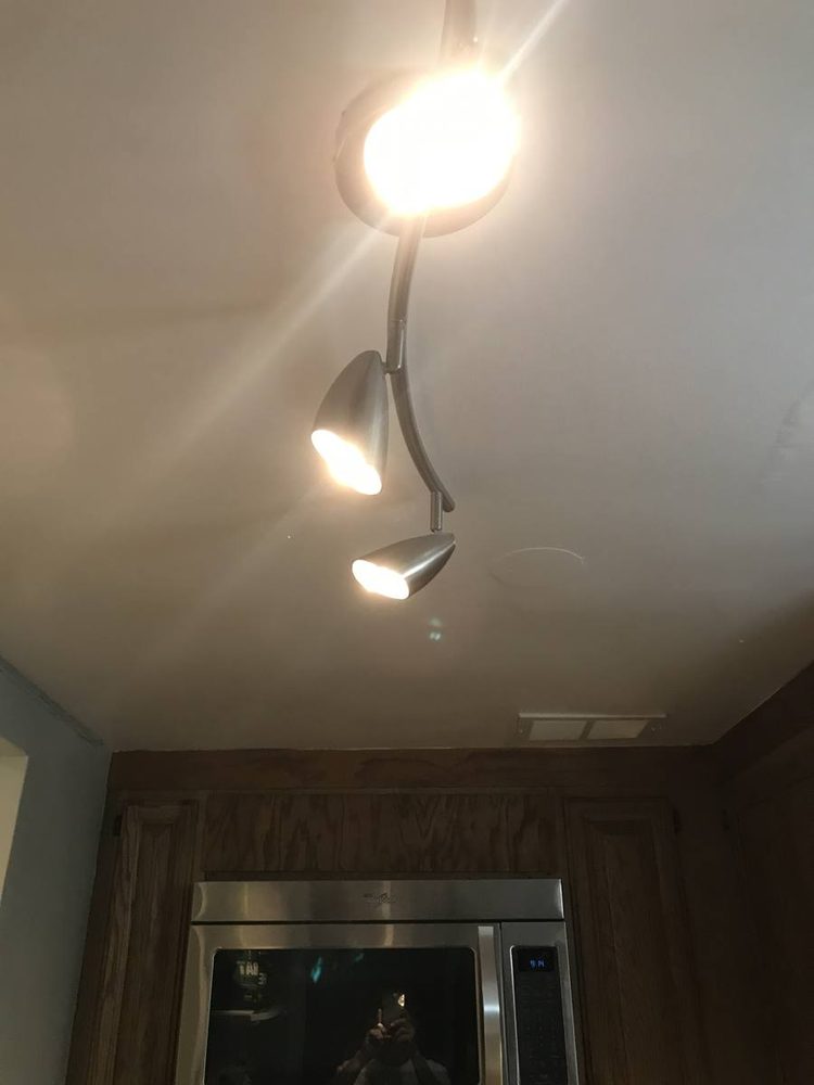 Light fixture mounted and wired to a ceiling