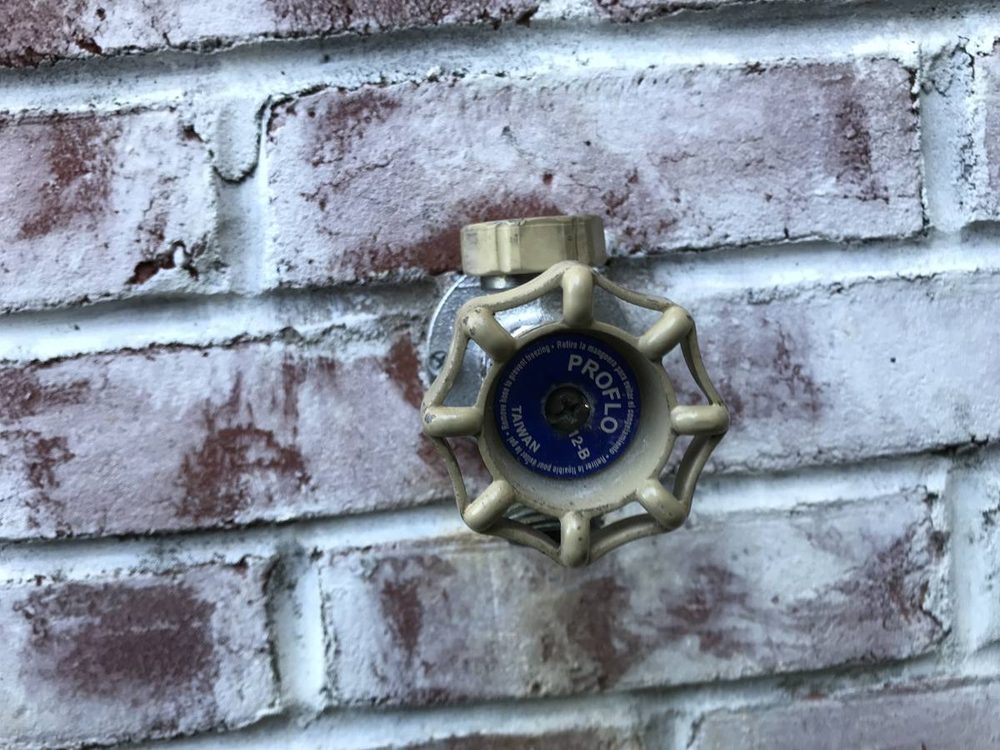Outdoor hose spigot on an exterior wall