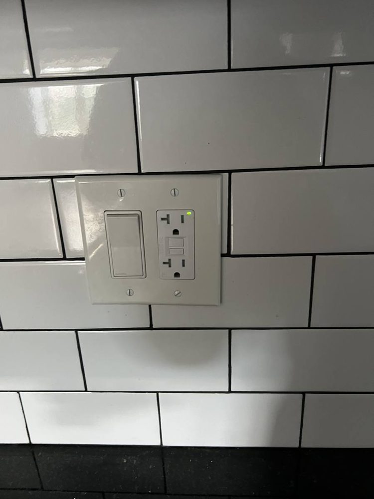 Replacement wall outlet and switch plate installed
