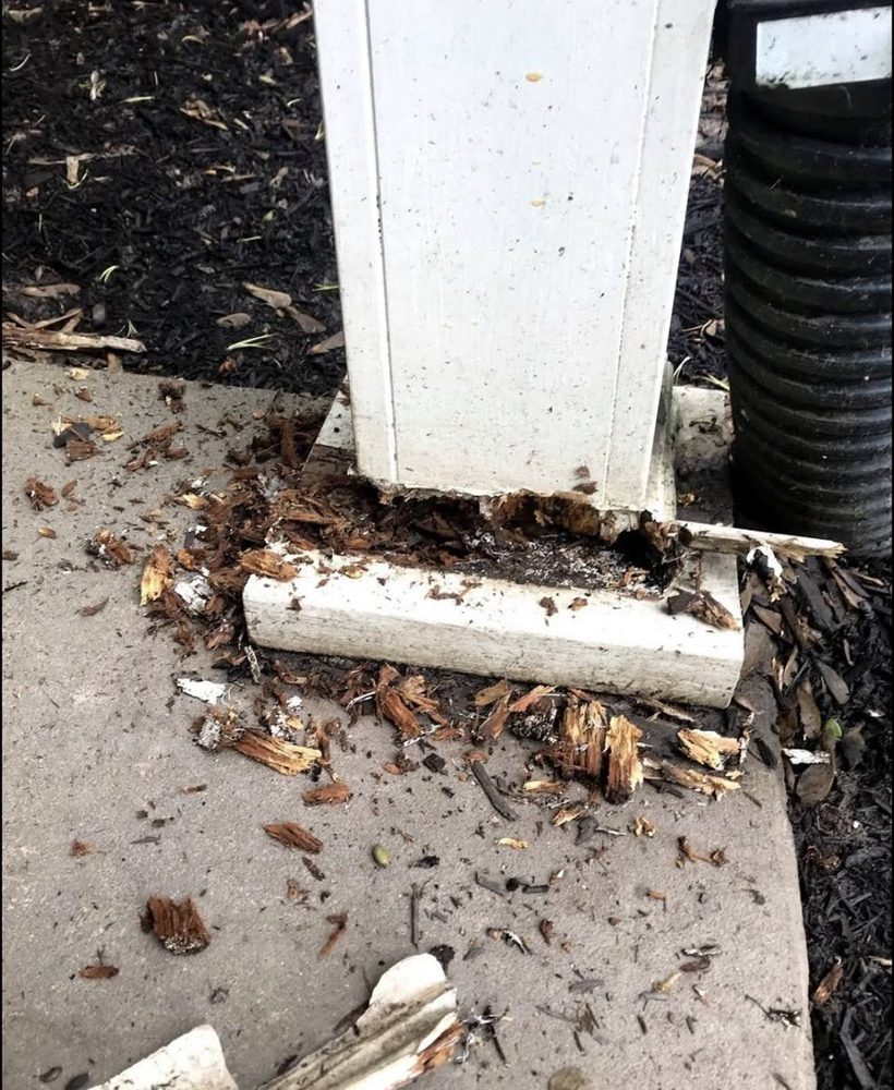 Porch column base repaired and refinished, before the work