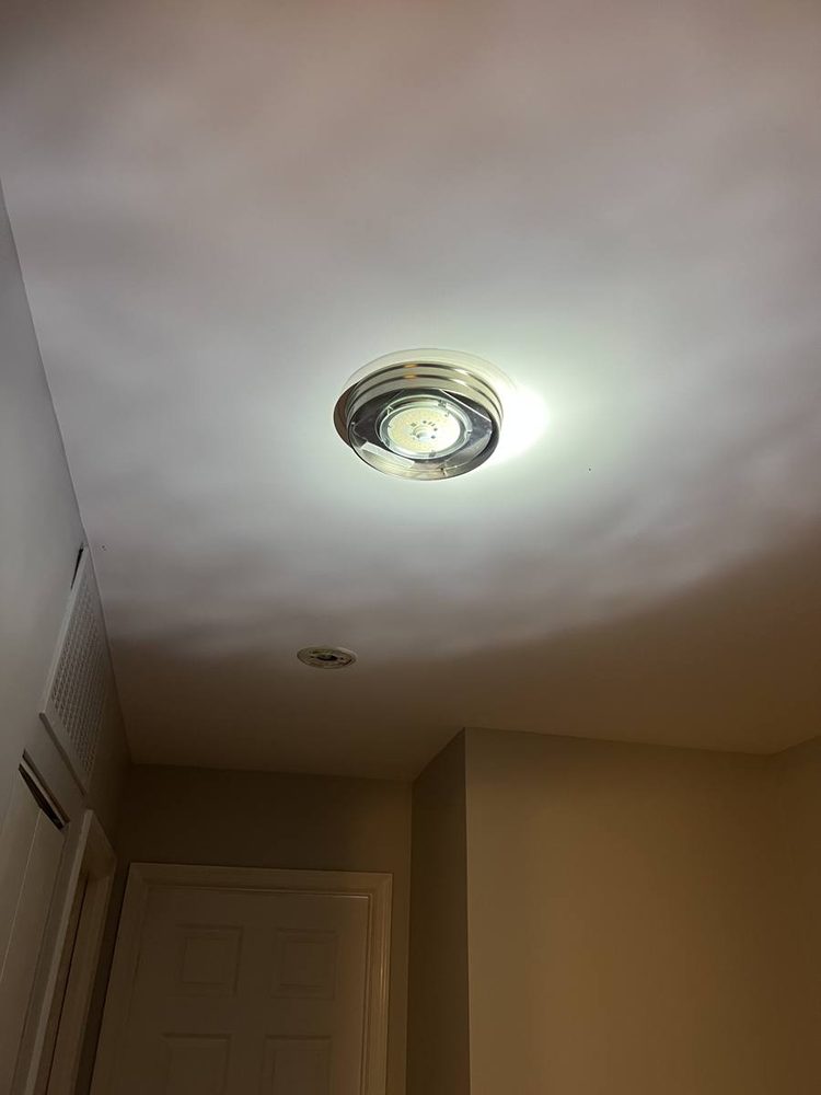 Recessed ceiling light installed with trim fitted