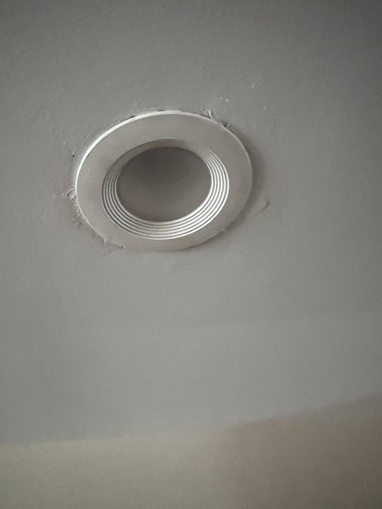 Recessed ceiling light installed with trim fitted