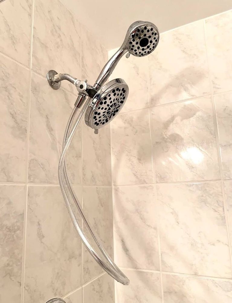 Shower head installed and running, after the work