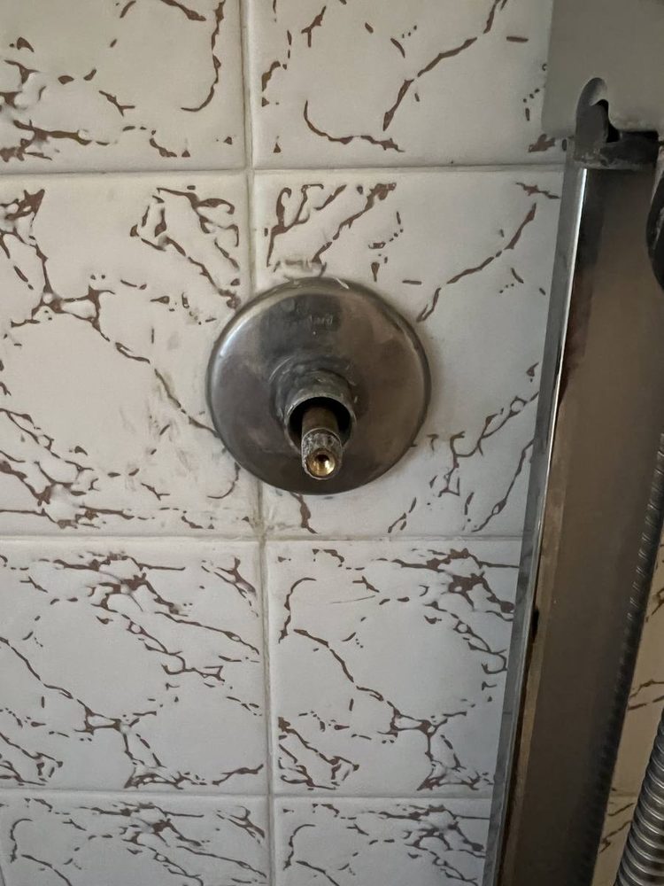 Shower and tub valve trim installed on a finished wall