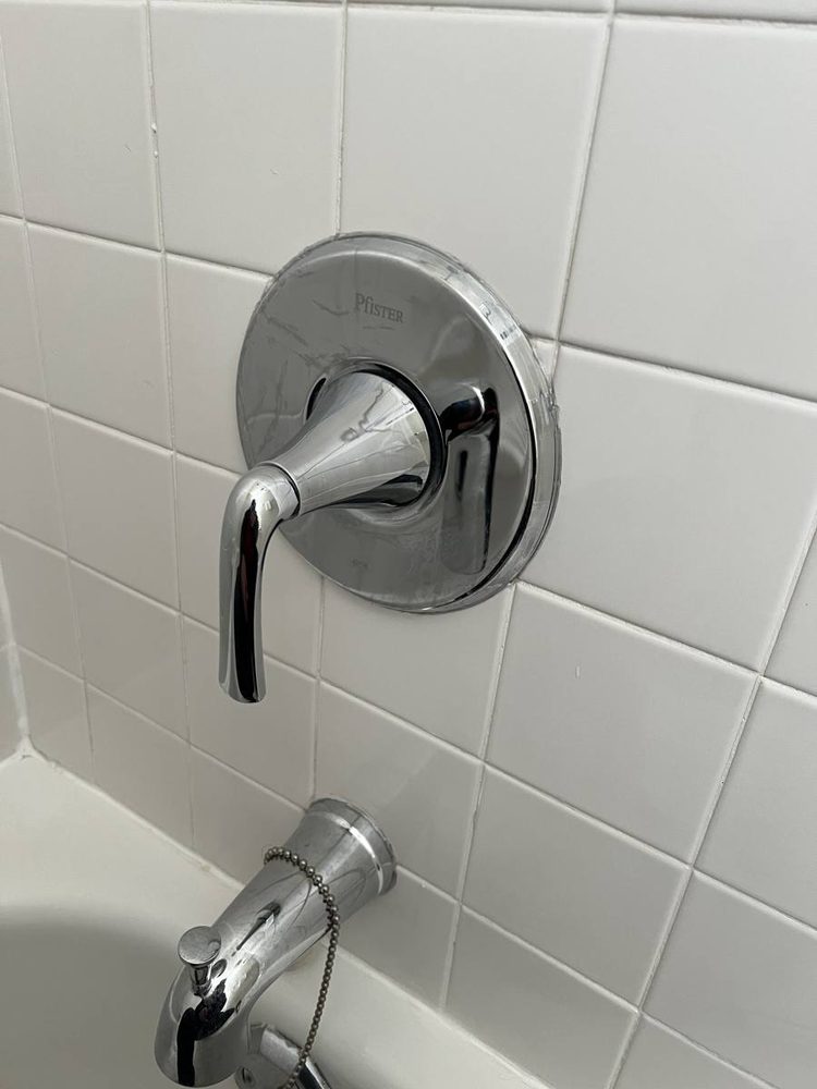 Shower and tub valve trim installed on a finished wall