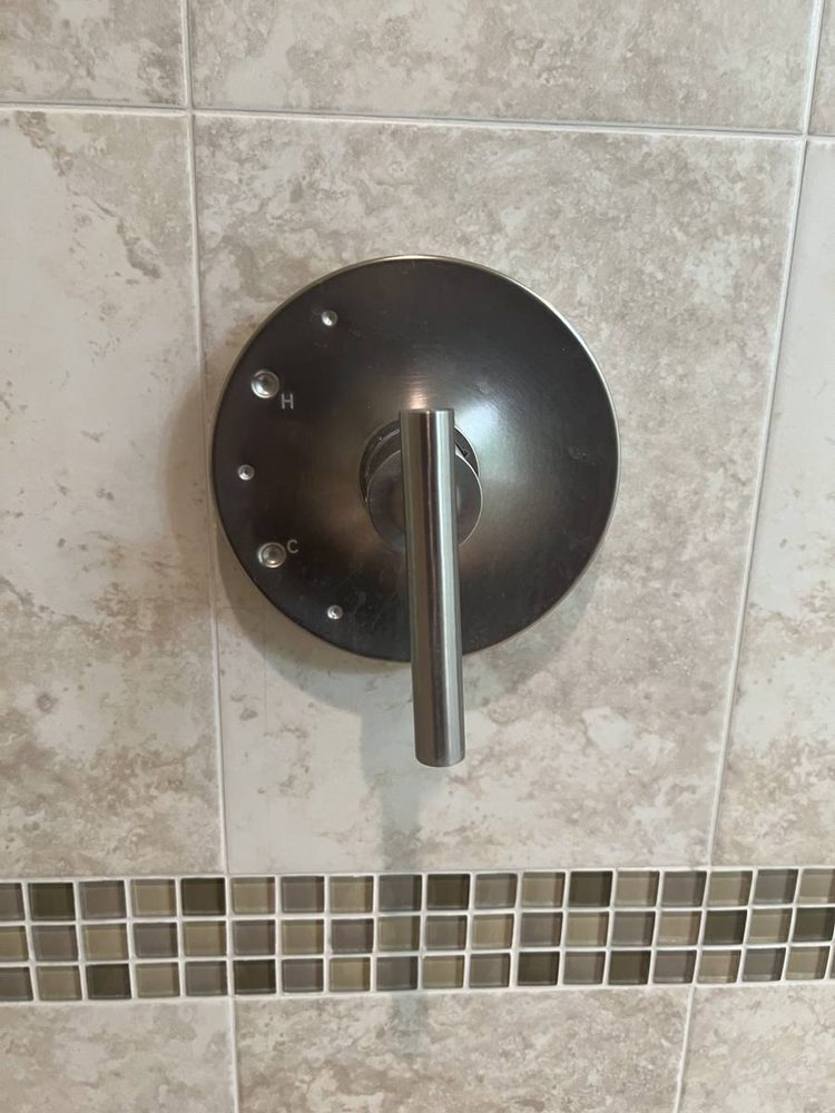 Shower and tub valve trim installed on a finished wall