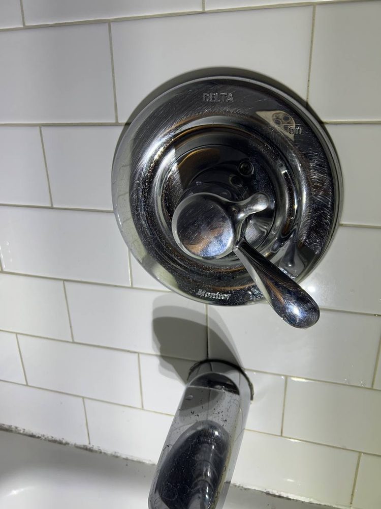 Shower and tub valve trim installed on a finished wall