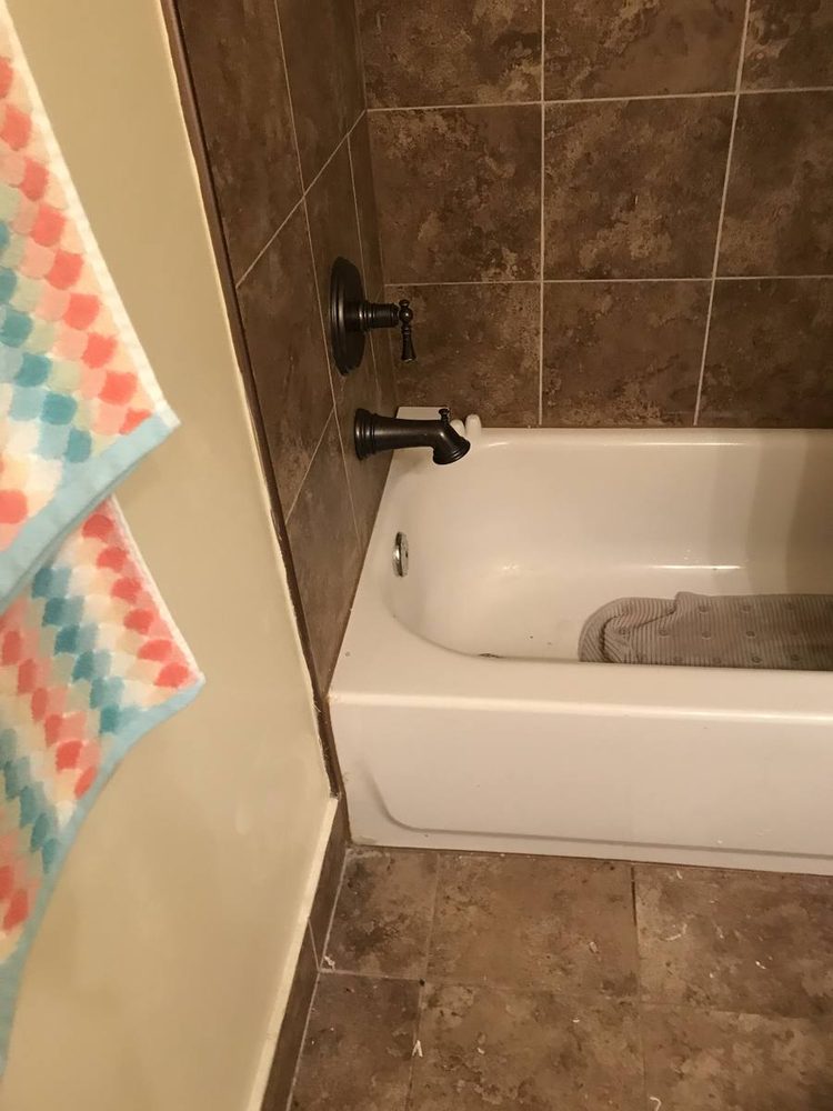 Shower and tub valve trim installed on a finished wall