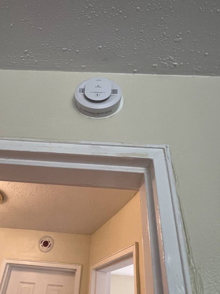 Smoke and carbon monoxide detector mounted to a ceiling