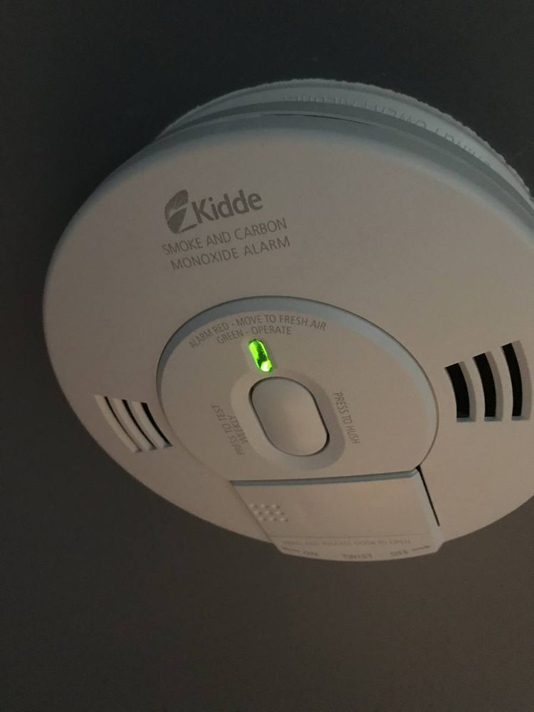 Smoke and carbon monoxide detector mounted to a ceiling