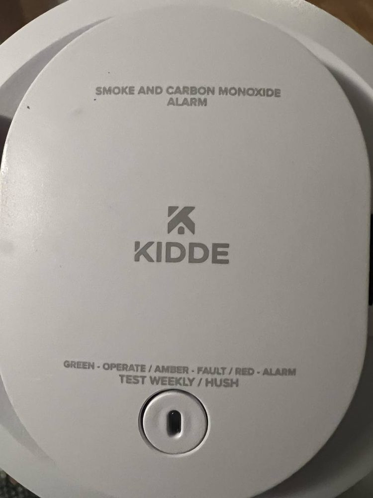 Smoke and carbon monoxide detector mounted to a ceiling